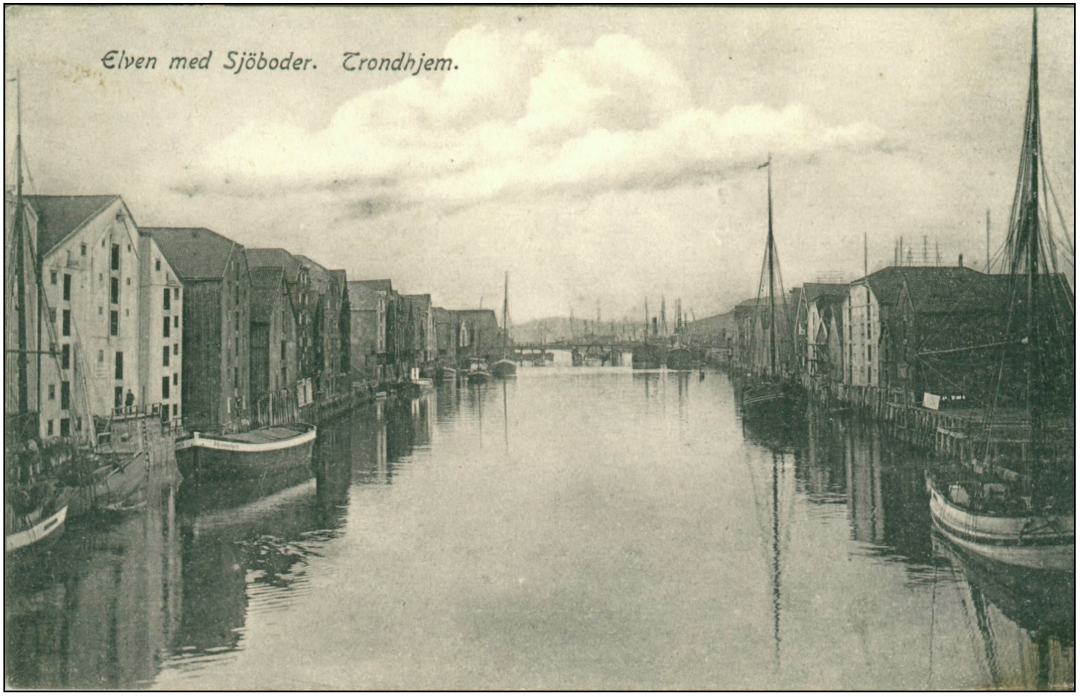 Et eldre fotografi av sjøboder langs Nideleven