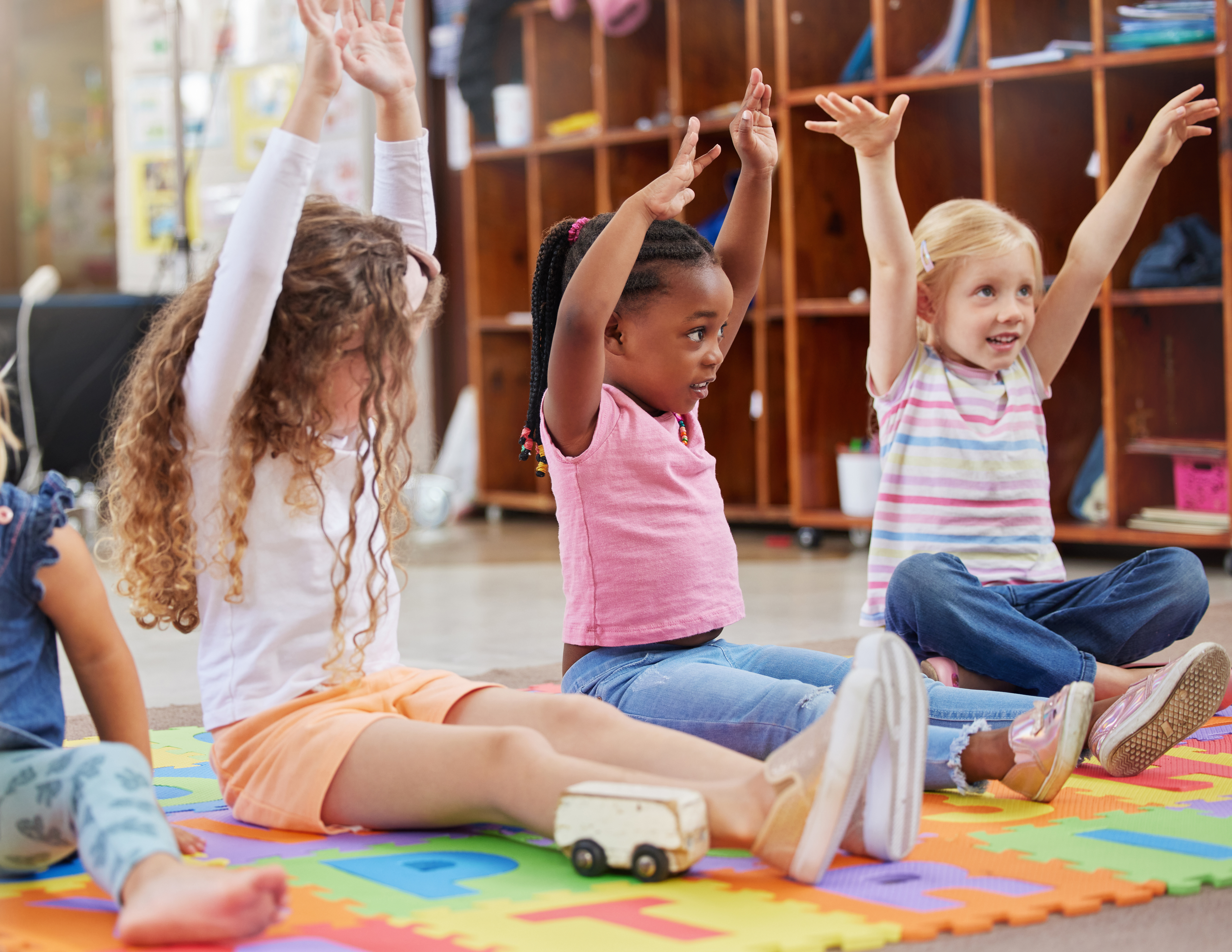 Education - children raise hands